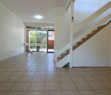RENOVATED TOWNHOUSE - CLOSE TO ALL AMENITIES!!! - Photo 1