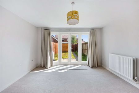 Charming mid-terrace home offering versatile living space, private garden, off-street parking and car port - Photo 2