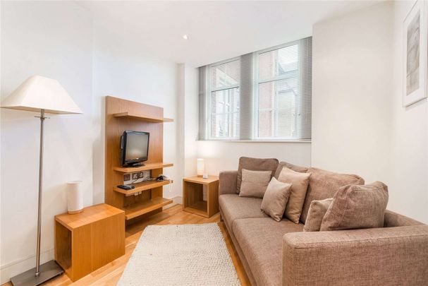 Well presented two bedroom apartment, in a highly regarded building with 24 hr concierge service, a residents' gym and garaged parking for 1 car. - Photo 1