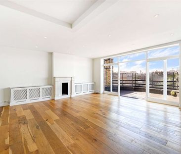 A spectacular duplex penthouse apartment with two incredible roof terraces on the fourth and fifth floors of this period conversion with lift access and access to the communal gardens. - Photo 4