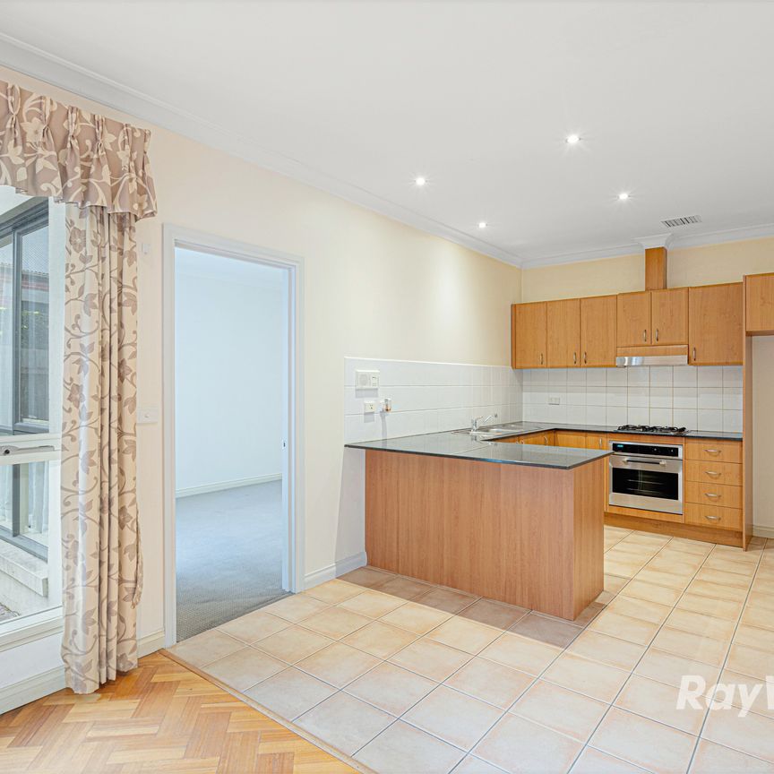 Sophisticated Two-Storey Townhouse with Private Garden & Modern Amenities - Photo 1
