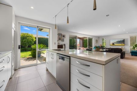 Welcome to this modern and inviting 3-bedroom rental home in Welcome Bay. - Photo 2