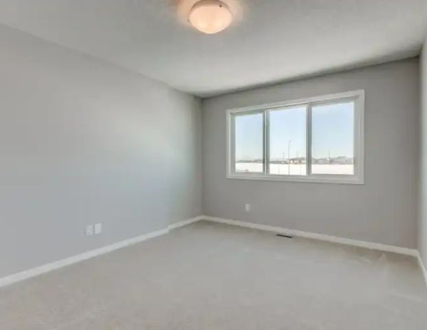 Front-drive home with 4 Bed +Deck + AC + Finished Basement | 1 - 968 Seton Circle Southeast, Calgary - Photo 1