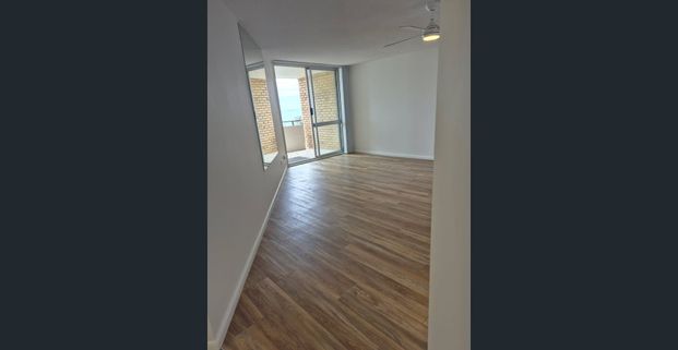 LOCATED IN THE HEART OF SURFERS IN THE HISTORICAL “ THE SANDS “ BUILDING IS THIS DELIGHTFUL 5TH FLOOR UNIT LOOKING OVER SURF VIEWS ACROSS THE STR - Photo 1