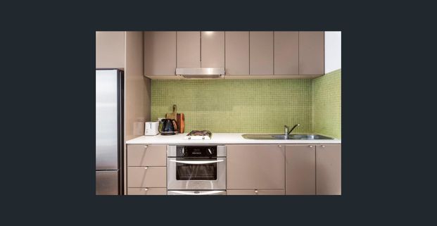 FURNISHED EXECUTIVE STYLE ONE BEDROOM APARTMENT WITH 2 CARSPACES - Photo 1