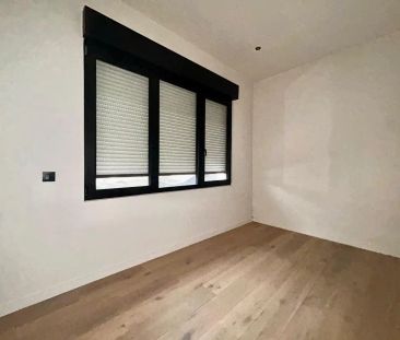 Gezellig gelijkvloers 2-slpk app met tuin. - Foto 2