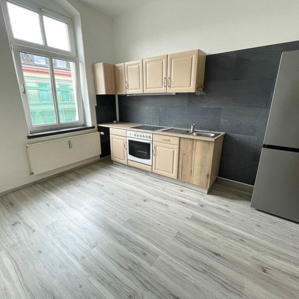 Moderne 1-Raum-Wohnung mit Einbauküche - Foto 1