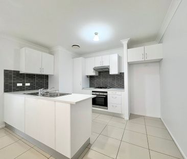 Modern Three Bedroom Home in Great Location! - Photo 1