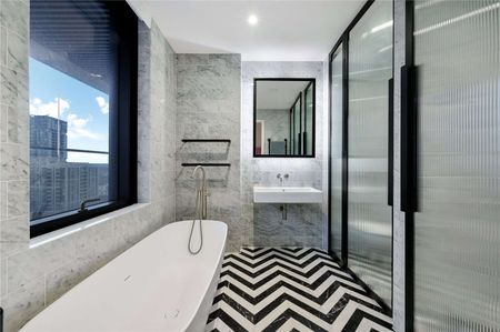 Large wrap around garden balcony, with dual aspect south westerly views from this stylish two bedroom apartment, located in Wardian's West Tower. - Photo 2