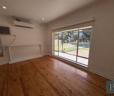 Spacious 4 Bedroom Home with Multiple Living Areas - Photo 1