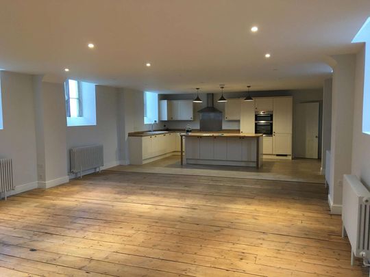 A unique four-bedroom home converted from a former Gospel Hall in 2017, set in an idyllic rural position on the edge of Neston village. The property offers spac - Photo 1