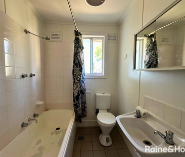 Neat & Tidy Home with Generous Backyard - Photo 1
