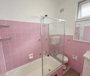 BRIGHT AND AIRY TOP FLOOR TWO BEDROOM APARTMENT - Photo 3