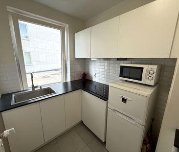 Licht en ruim 2-slaapkamerappartement met terras in hartje Leuven - Photo 3