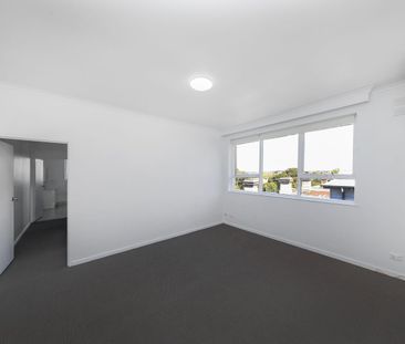 RENOVATED TOP-FLOOR OASIS – WALK TO THE STATION! - Photo 3