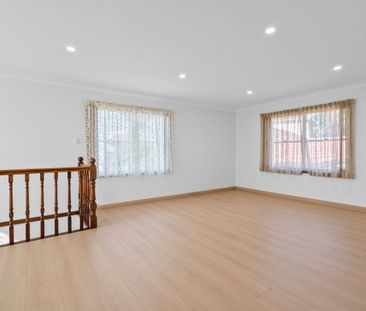 Expansive Five-Bedroom Home with Large Backyard - Photo 1