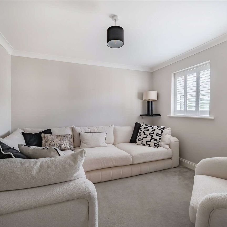 An immaculately presented four-bedroom detached family home with garaging. - Photo 1