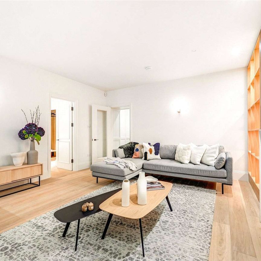 An interior designed newly renovated two bedroom apartment in this well maintained red brick building. - Photo 1