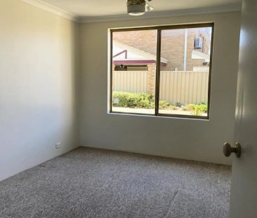 Low maintenance living. - Photo 1