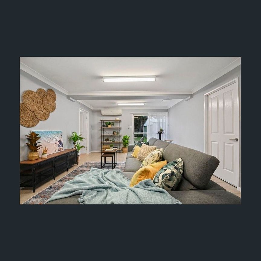 Beautiful Highset Home with a Great Shed - Photo 1