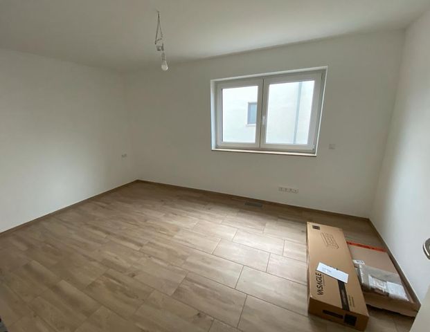 Lichtdurchflutete ebenerdige 2,5-Zimmer-Neubauwohnung in Top Lage - Foto 1