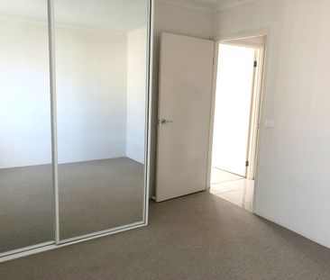 Sunny top floor unit - Photo 1