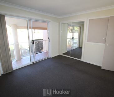 UPDATED THREE BEDROOM TOWNHOUSE BY THE LAKE! - Photo 1