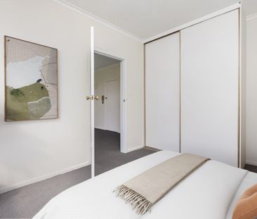 Stylish Two-Bedroom Gem with Secure Parking in a Winning Location! - Photo 1