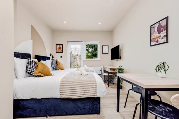 Posh Studio Stay with Functional Kitchenette - Photo 1