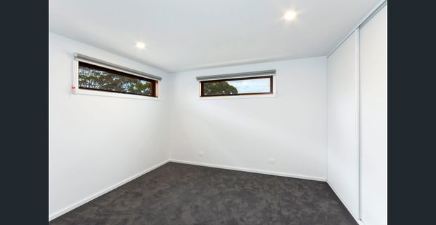 Modern Two-Bedroom Townhouse in a Prime Location - Photo 1