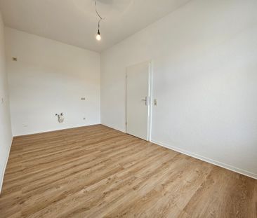 Diese schöne renovierte Wohnung wartet auf Sie mit Einbauküche - Photo 4