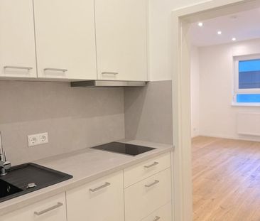 Kernsanierte Apartmentwohnung mit hochwertiger Einbauküche und eben... - Foto 1