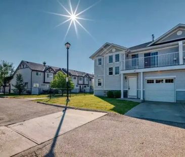 Spacious 3 bedroom townhouse with attached single garage. Close to all amenities | 79 Country Village Circle Northeast, Calgary - Photo 1