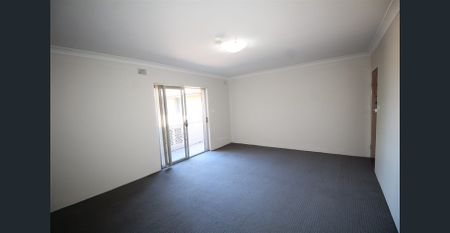ONE WEEKS RENT FREE - TOP FLOOR TWO BEDROOM UNIT WITH GARAGE - Photo 2
