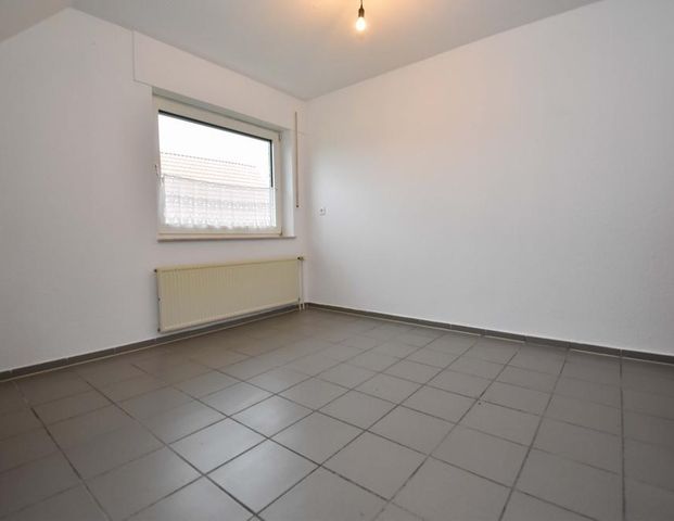 Dachgeschoswohnung mit Garage in ruhiger Siedlungslage in Markhausen - Foto 1