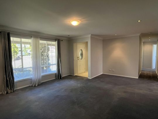 Bright Family Home with Sunroom and Outdoor Living Space - Photo 1