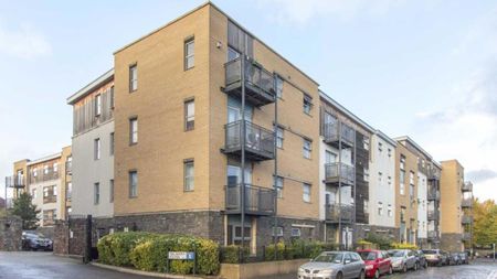 A large two double bedroom, top floor flat with own parking space in a private garage. - Photo 3