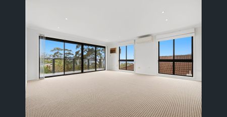 Elevated Coastal Living with Water Views and Space for the Whole Family - Photo 3