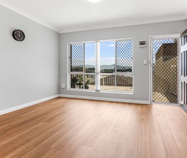 Coastal Convenience - Quiet Top-Floor Living - Photo 1