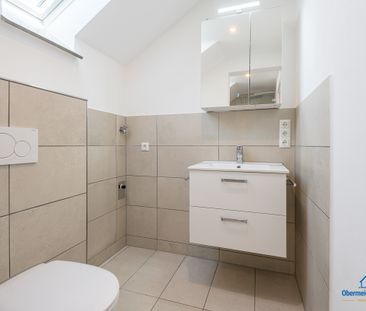 Top-sanierte Dachgeschosswohnung mit Garage und EBK in idyllischer ... - Photo 4