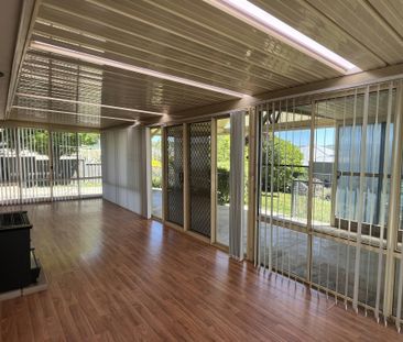 Bright Family Home with Sunroom and Outdoor Living Space - Photo 6