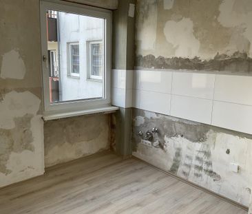 Schicke 2-Zimmer-Wohnung mit neuem Laminatboden in Hagen Zentrum! - Photo 2