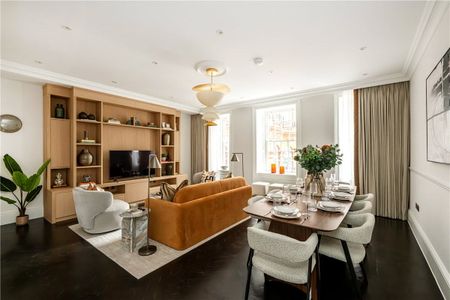 A superb three-bedroom, three-bathroom lateral apartment in a prestigious red brick building on Stratton Street, Mayfair. - Photo 4