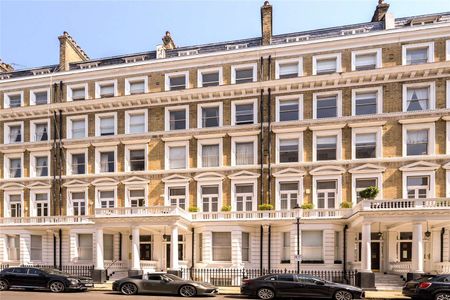 Located in the heart of South Kensington a striking three bedroom period conversion with own entrance, a vast reception room boasting double height ceilings and wooden floors. - Photo 2