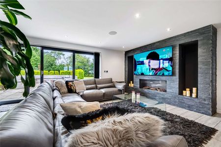 An exceptional architect designed residence set within a 0.75 acre plot, enjoying far-reaching countryside views and offering 3156 sq ft of contemporary living through. - Photo 2