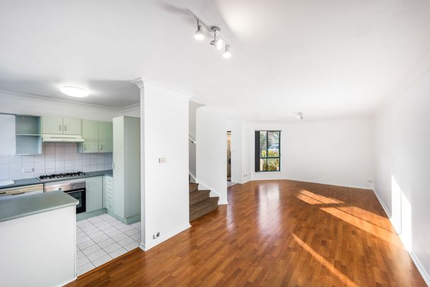 IMMACULATE TOWNHOUSE WITH POOL - Photo 1