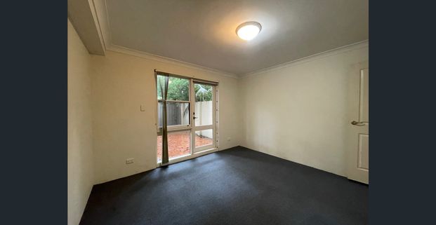 Tranquil sanctuary with lock up garage, convenient hassle-free urban living - Photo 1