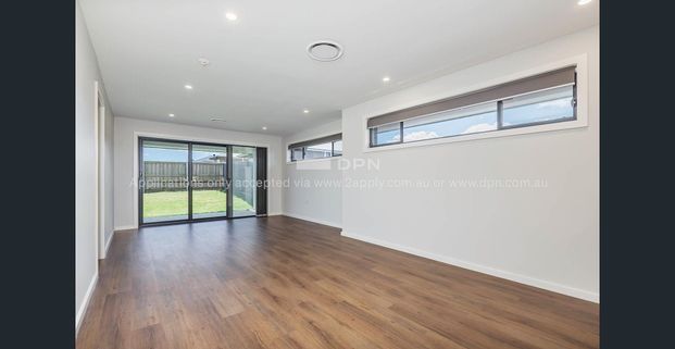 Brand New Four Bedroom Home! - Photo 1