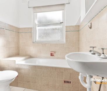 “Tidy solid home with a lush backyard” - Photo 4
