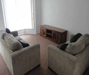 SPACIOUS SOUTH GLADSTONE UNIT IN QUIET LOCATION! - Photo 1